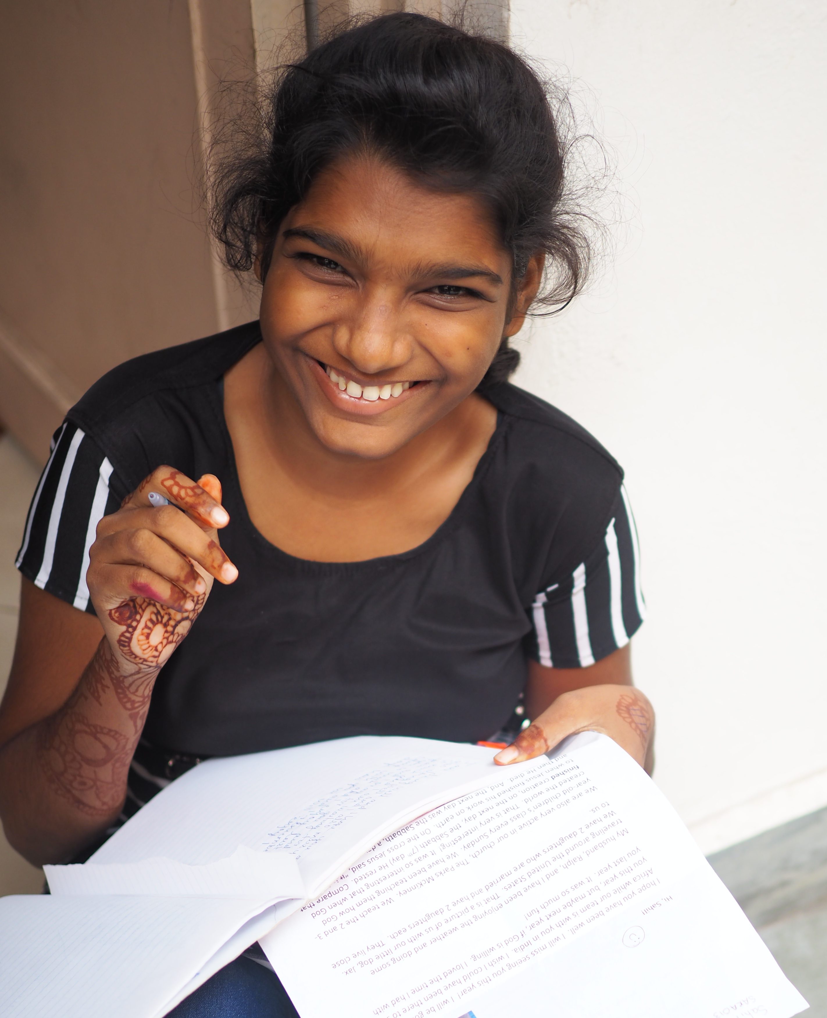 Harshita in South Asia responding to her sponsor's letter.